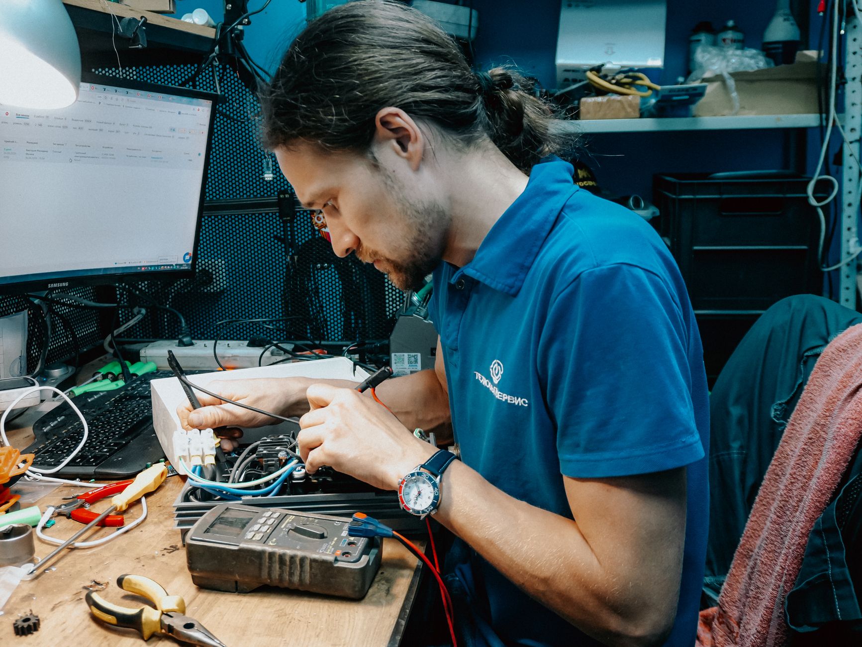 X.Q Electrical technician completing careful electrical repair work for a Doncaster customer