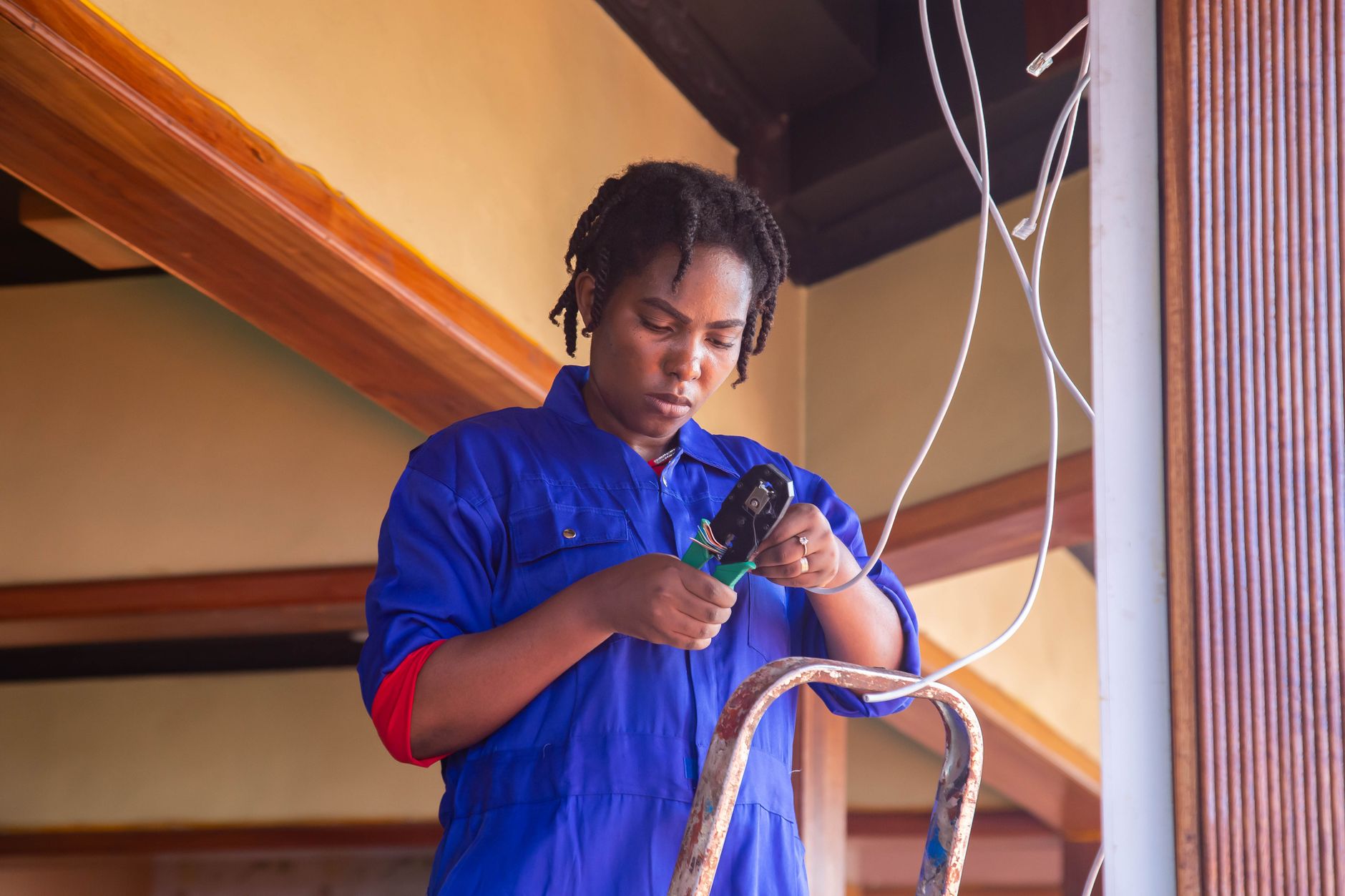 Professional electrician wiring a consumer unit with skill and concentration in a Doncaster home